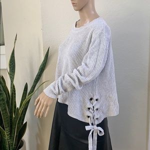 Sweater with side ties